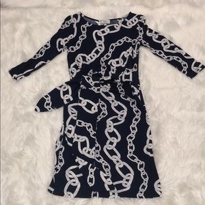 Midi dark blue/white dress with a detail in front
